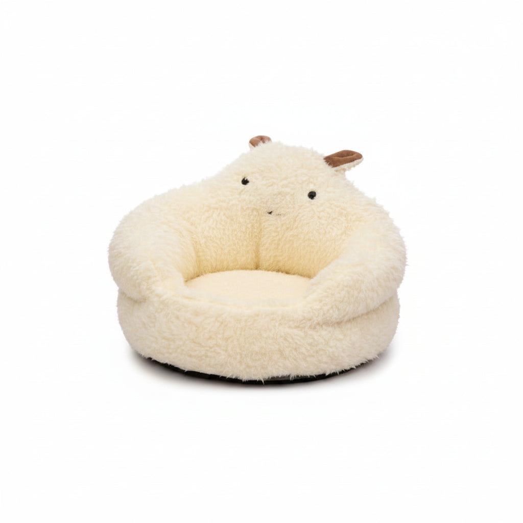 Dog lying in a fluffy white pet bed in a bedroom setting.