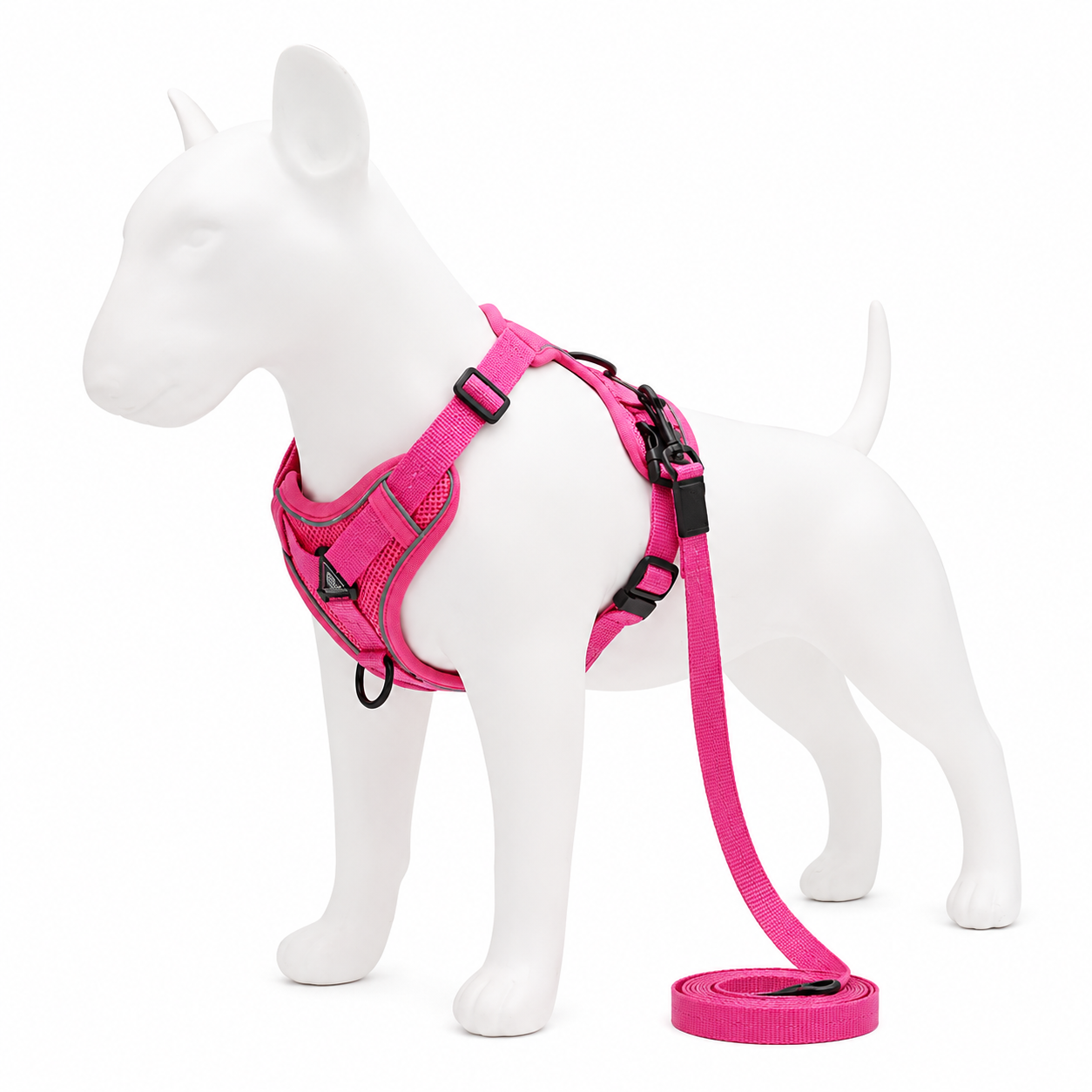 Pink dog harness and leash set on a white mannequin