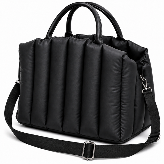 Black duffel bag with handles and a shoulder strap on a white background