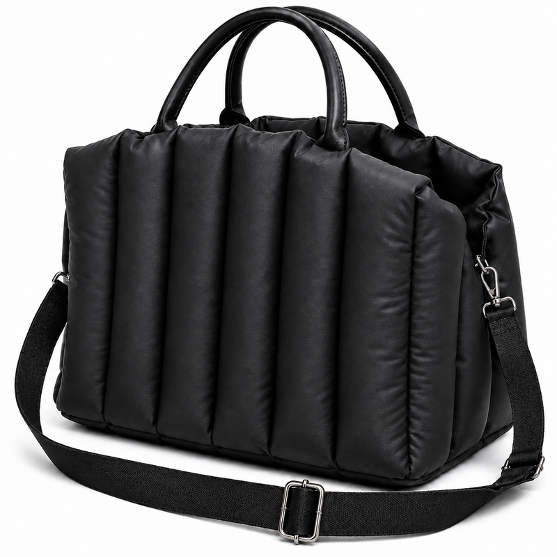 Black duffel bag with handles and a shoulder strap on a white background