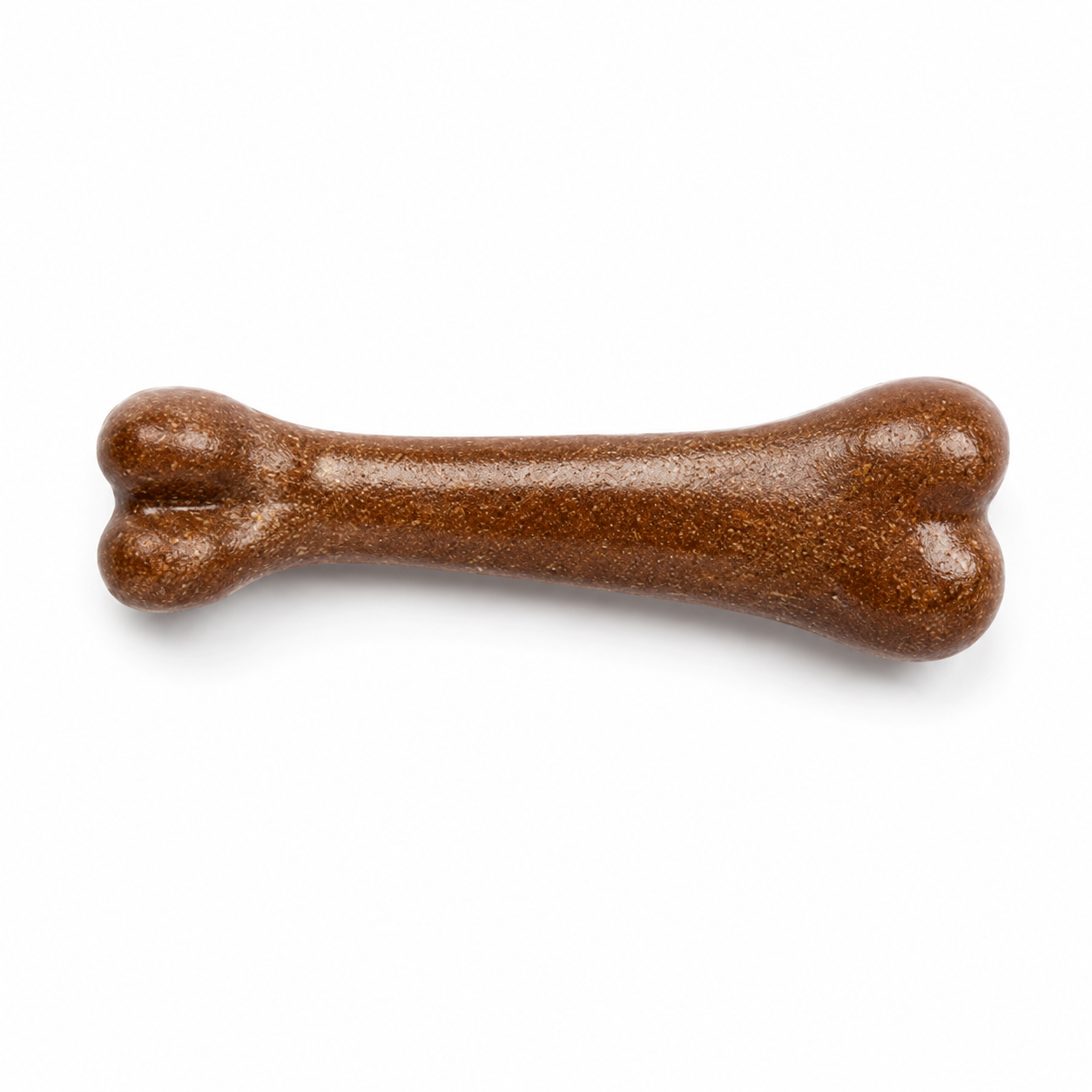 Brown bone-shaped treat on a white background