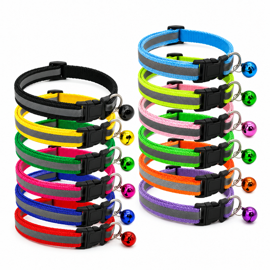 Colorful pet collars with reflective stripes and small bells on a white background